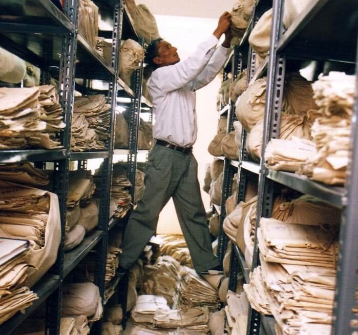 Man In Crowded Records Room